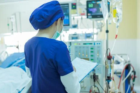 The specialist are checking continuous renal replacement therapy equipment. Stock Photos