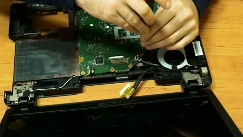 Specialist assembles a laptop after basic cleaning and repairing Video stock 81827756