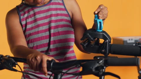 Specialist assembling workstand to do bicycle maintenance, close up Stock Footage 263685098