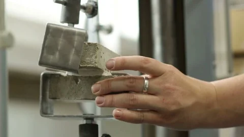 Specialist Conducts Test on Cement Strength Video stock 72680295