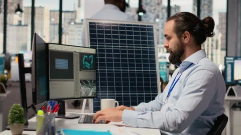 Specialist develops clean energy solutions, drinks coffee, talks with coworker 스톡 동영상 316003317