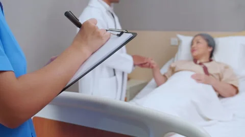 Specialist doctor man explaining and check with elderly patient while close.. Stock Footage 246977792
