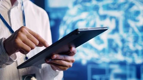 Specialist doing AI simulation on tablet Stock Photos