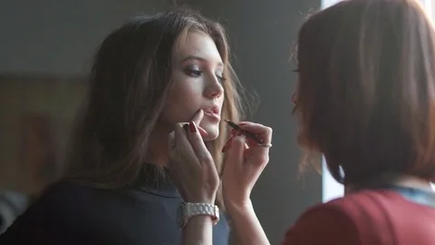Specialist doing makeup for model. Backstage of fashion industry. Stock Footage 74124290