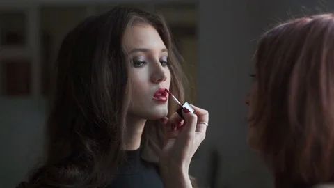 Specialist doing makeup for model. Backstage of fashion industry. Stock Footage 74125234