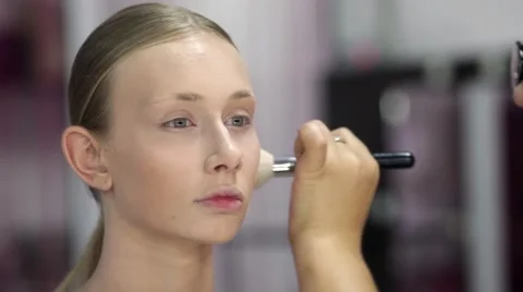 Specialist doing makeup for model. Gentle make-up for the young girl. Stock Footage 67318709