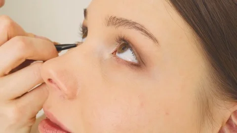 Specialist doing makeup for model. Gentle make-up for the young girl. Video stock 74520965