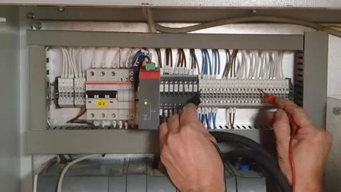 Specialist electrical commissioning engineer investigating a fault on a switch Stock Footage 335038772