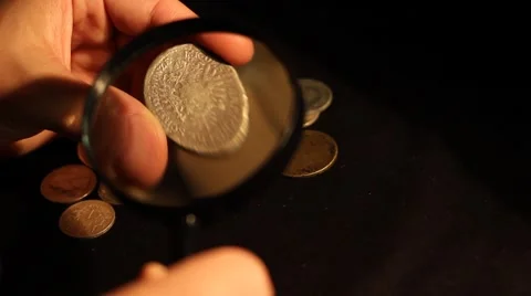 Specialist Evaluates Coins Stock Footage 46126932