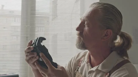 Specialist Inspecting Bionic Arm in Workshop Stock Footage 251873783