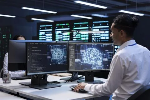 Specialist inspecting neural network data center used for machine learning Stock Photos