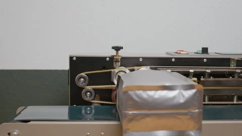 Specialist Launching Sealing Machine to Pack Coffee Grains at Roastery Stock Footage 299700872