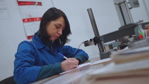 The specialist makes notes in a notebook, the girl keeps records Stock Footage 264050564