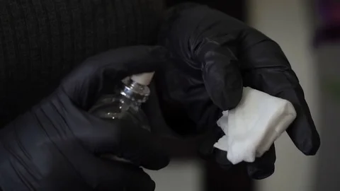 The specialist of permanent make-up sprays the liquid for disinfection on a Stock Footage 83327402