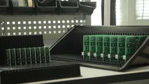 Specialist puts printed circuit boards in box Stock Footage 80921563