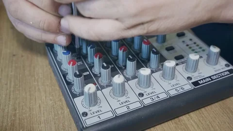 A specialist repairs an old mixing console Stock Footage 126393602