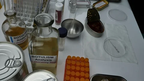 Specialist scientist opens infected canned food, botulism infection in sick peop Stock Footage 130054582
