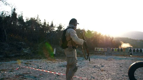 Specialist from the special forces unit makes firing at a military training Stock Footage 128126493