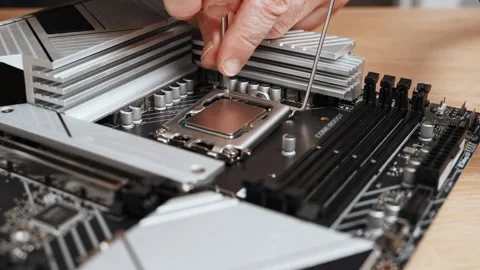 A specialist unscrews the socket mounting screw with a screwdriver and removes Stock Footage 300196017