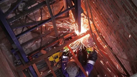 Specialist working with angle grinder in elevator shaft Stock Footage 114973273