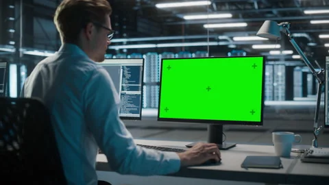 Specialist Working on Green Screen Computer in Data Center.mov Stock Footage 167226329