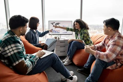 Specialists conducting data analysis on display in office Stock Photos