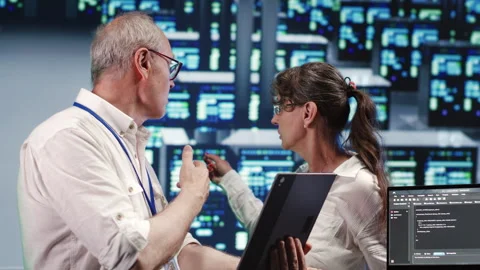 Specialists running code in data center Stock Footage 247903166