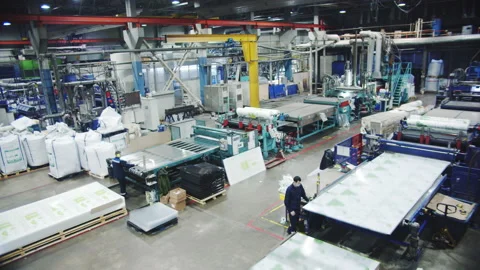 Specialists take polycarbonate sheets from conveyors Stock Footage 231724121