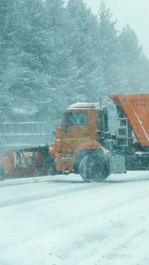 Specialized snow removal equipment clears snow from the highway. Stock Footage 329923484