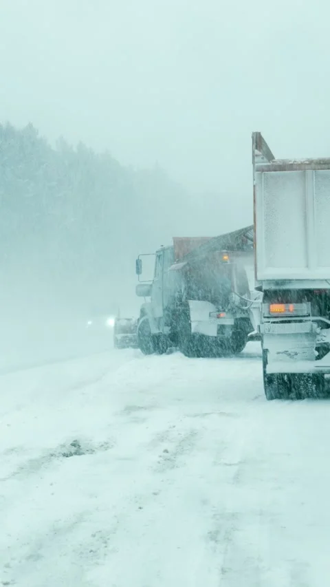 Specialized snow removal equipment clears snow from the highway. Stock Footage 329923489