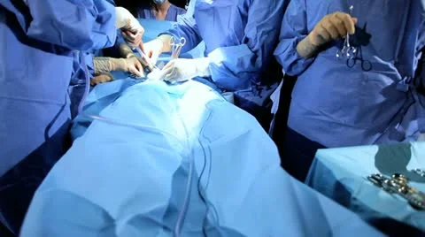Specialized Team Performing Surgery in Operating Room Stock Footage 12689147