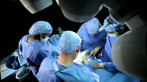 Specialized Team Performing Surgery in Operating Room Video stock 18747627