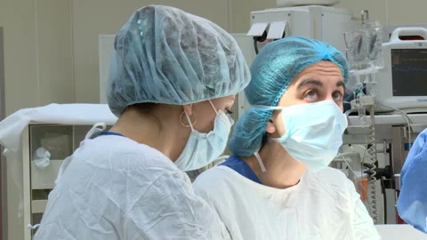Specialized Team Performing Surgery In Operating Room Stockbeeldmateriaal 86330682