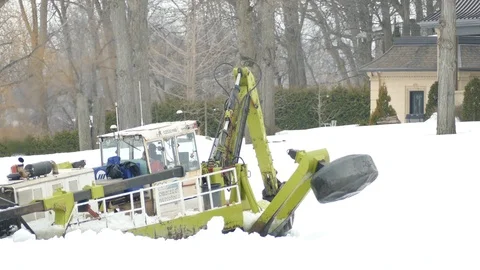 Specially customized ice breaking vehicle in operation for spring procedures Stock Footage 117057092
