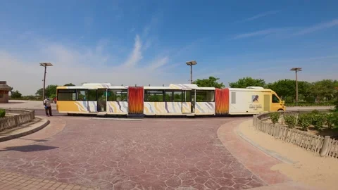 A specially designed bus for transit people across the park waiting for people. Stock Footage 185571050