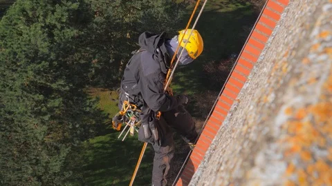 Specially equipped worker performs height work. Work at height Vídeo Stock 96566380