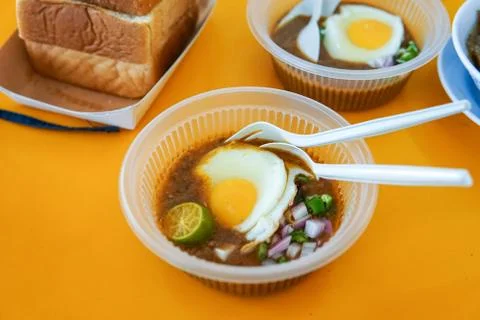 Specially made toasted bread with bean sauce served with egg, popular in Stat Stock Photos