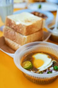 Specially made toasted bread with bean sauce served with egg, popular in Stat Stock Photos