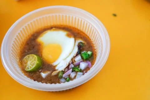 Specially made toasted bread with bean sauce served with egg, popular in Stat Foto stock
