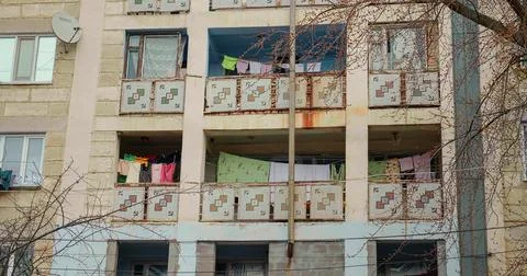 Specific balcony style from concrete Post Communist Buildings. Stock Photos