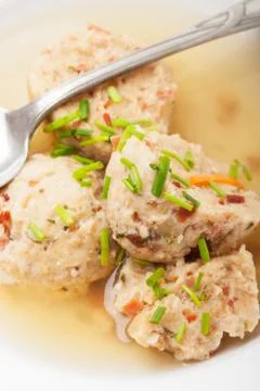 Speckknoedel, a tyrolean dumpling in broth Stock Photos