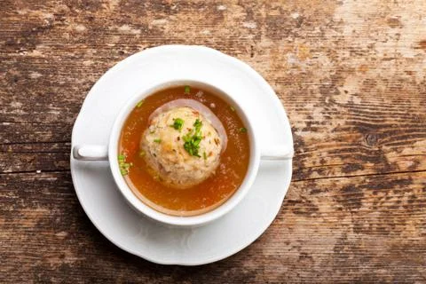 Speckknoedel, a tyrolean dumpling in broth Stock Photos