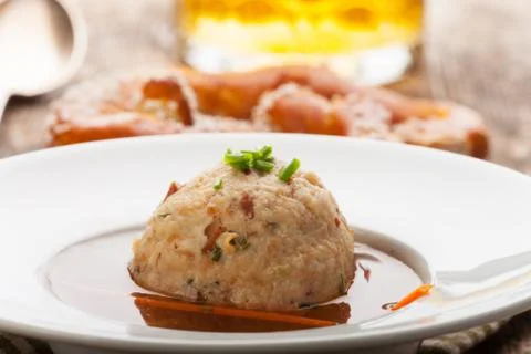 Speckknoedel, a tyrolean dumpling in broth Stock Photos