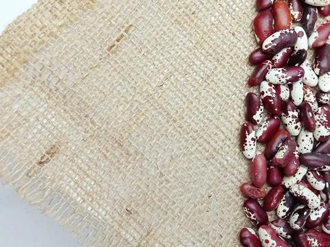 Speckled beans on rustic burlap background Stock Photos