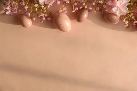 Speckled Easter Eggs and Cherry Blossoms on Peach Background. Festive Sprin.. Stock Photos