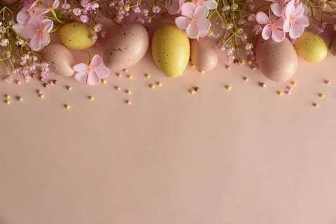 Speckled Easter Eggs and Cherry Blossoms on Peach Background. Festive Sprin.. Stock Photos