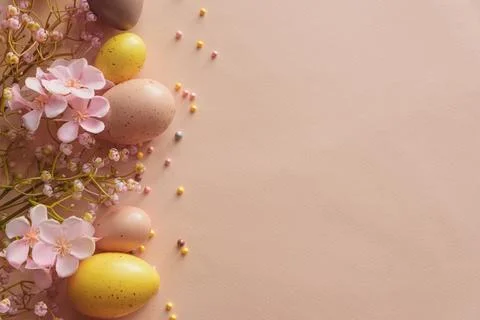 Speckled Easter Eggs and Cherry Blossoms on Peach Background. Festive Sprin.. Stock Photos