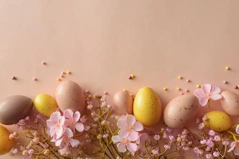 Speckled Easter Eggs and Cherry Blossoms on Peach Background. Festive Sprin.. Stock Photos