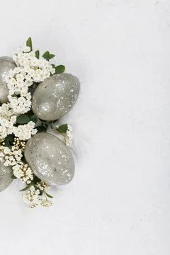Speckled easter eggs floral border minimal composition Stock Photos
