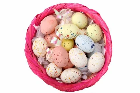 Speckled multicolored chocolate EASTER eggs in a basket Stock Photos